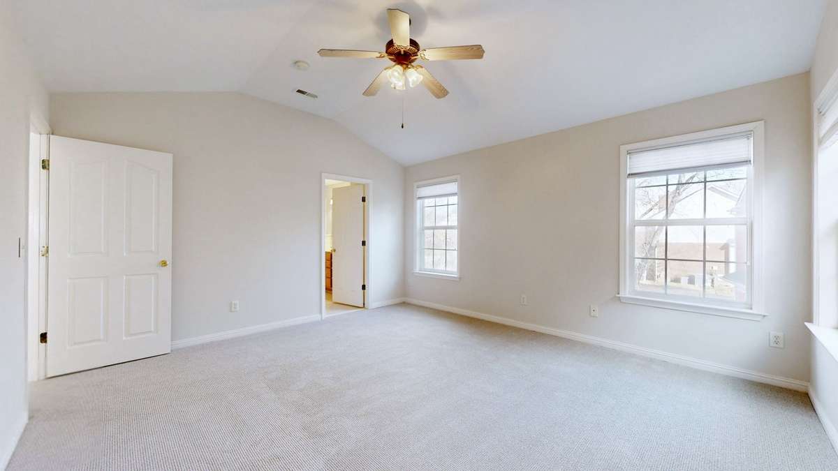The en suite Primary on the top floor with a walk in closet. More than enough room for a king bed and so much more. And the lovely new carpet!