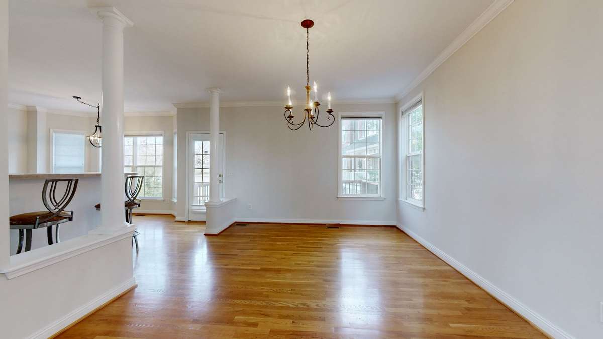 This dining room is so spacious.  Plenty of room for a large table, buffet, what ever you desire. You can see the back door that leads to a large deck.