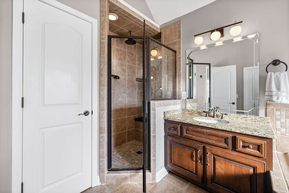 This additional photo shows how beautiful and spacious your Owners Suite Bathroom is and you will absolutely LOVE the wonderful full sized linen closet as well!