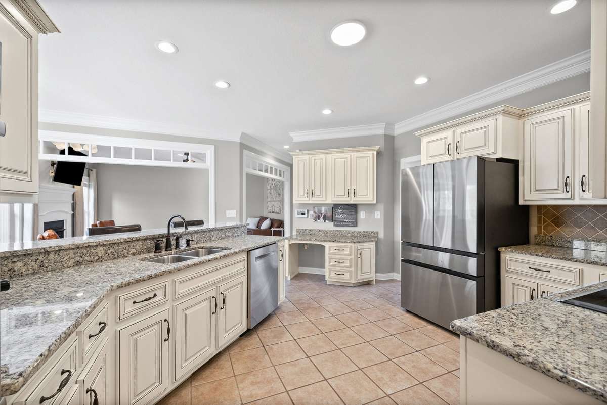 RARELY do homes at this price offer abundant custom cabinetry, luxury granite counter tops, massive cook and prep space, and a VIEW that is to die for while preparing your daily masterpieces.