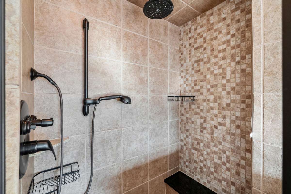 The current sellers had this shower completely remodeled and it's absolutely beautiful. You will also love the large linen closet and lots of cabinetry.