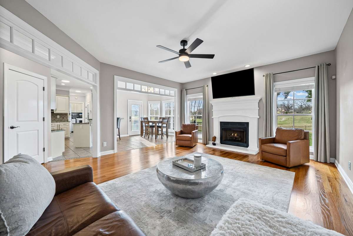 Let the Sunshine In...you will fall in love with this amazing living room, meticulous quality with transom windows, sunny windows, and centered fireplace and notice this massive open floorpan.