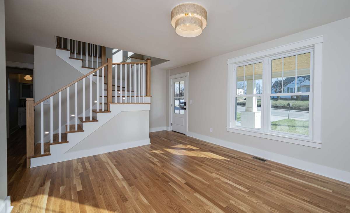 Step into the contemporary living area with main level 2-inch white oak flooring.