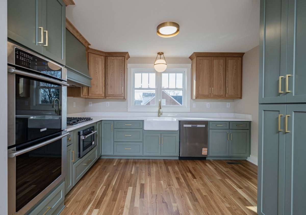 Farmhouse porcelain cast iron sink, ample custom cabinets and SS dishwasher