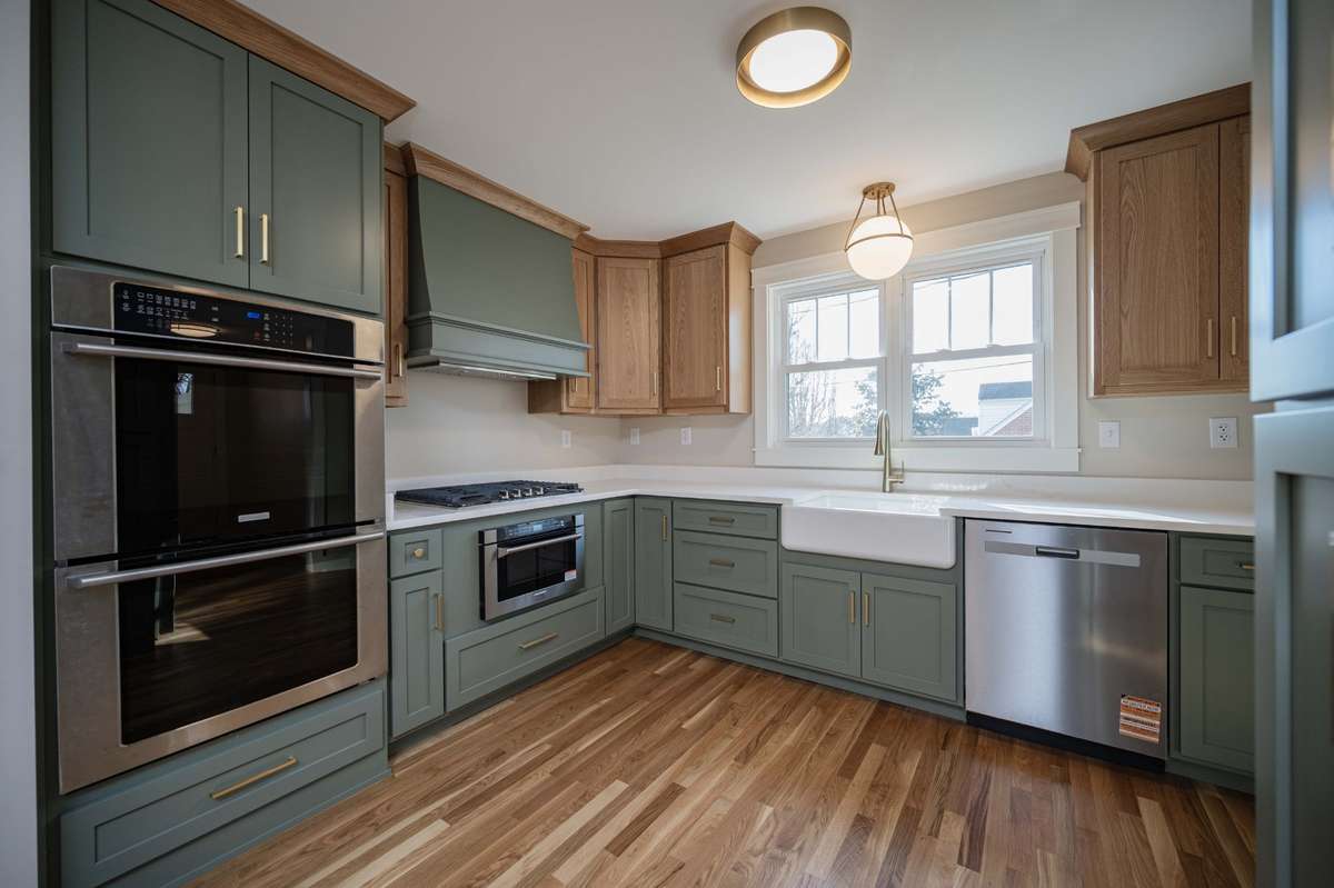 Chef kitchen w/ Stainless appliances and custom-built cabinetry