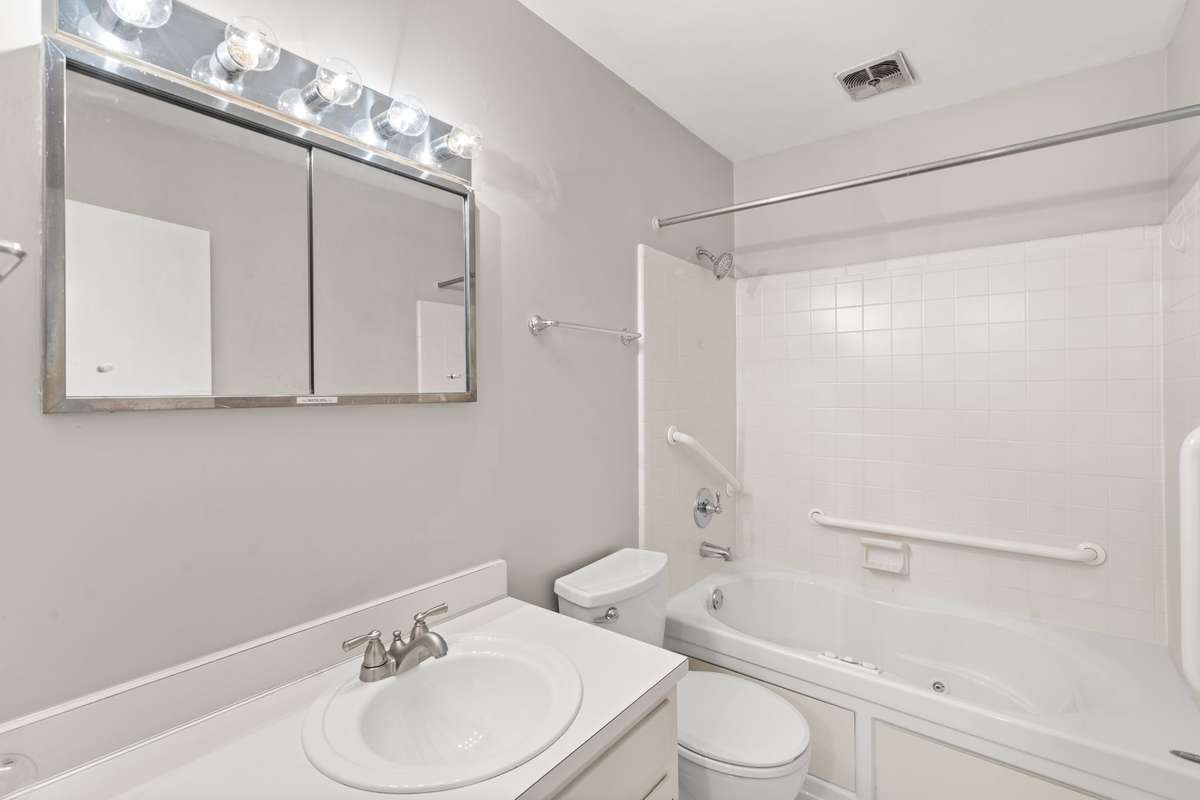 The secondary full Bathroom is located just beside the second Bedroom hallway. Shower/tub combo.