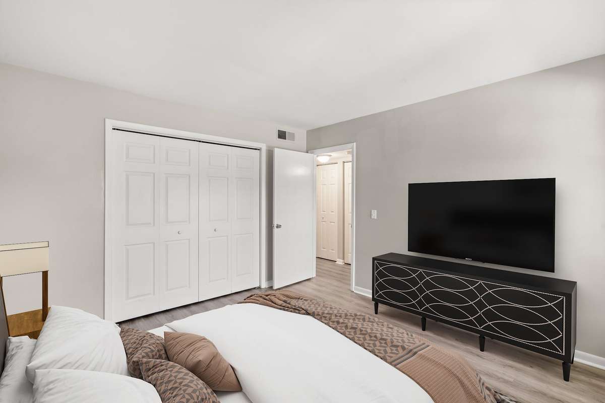 The second Bedroom also includes fresh paint, luxury vinyl plank flooring, lots of natural light, an extra large closet, and a charming window seat with storage. The second full Bathroom is located just beside the Bedroom. (Virtually staged.)