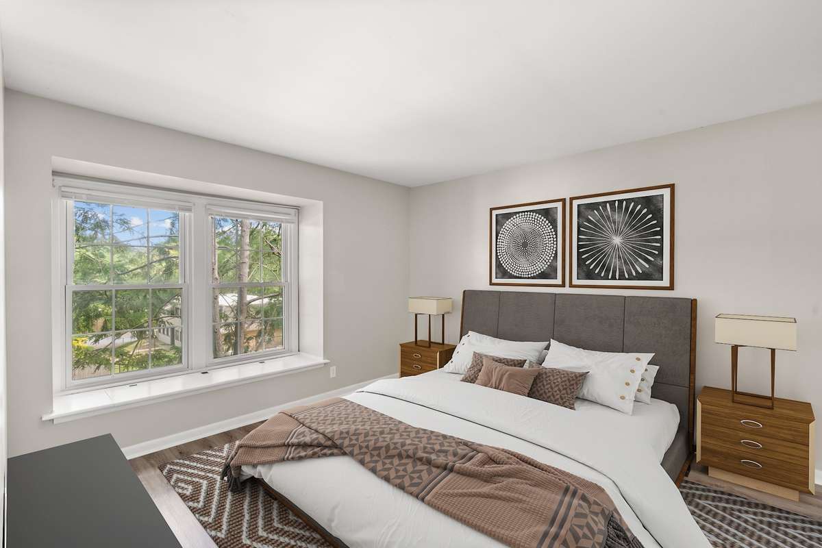 The second Bedroom also includes fresh paint, luxury vinyl plank flooring, lots of natural light, an extra large closet, and a charming window seat with storage. The second full Bathroom is located just beside the Bedroom. (Virtually staged.)
