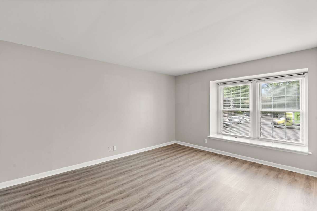The first Bedroom offers lots of natural light, en suite Bathroom, luxury vinyl floors, fresh paint, and a spacious closet.