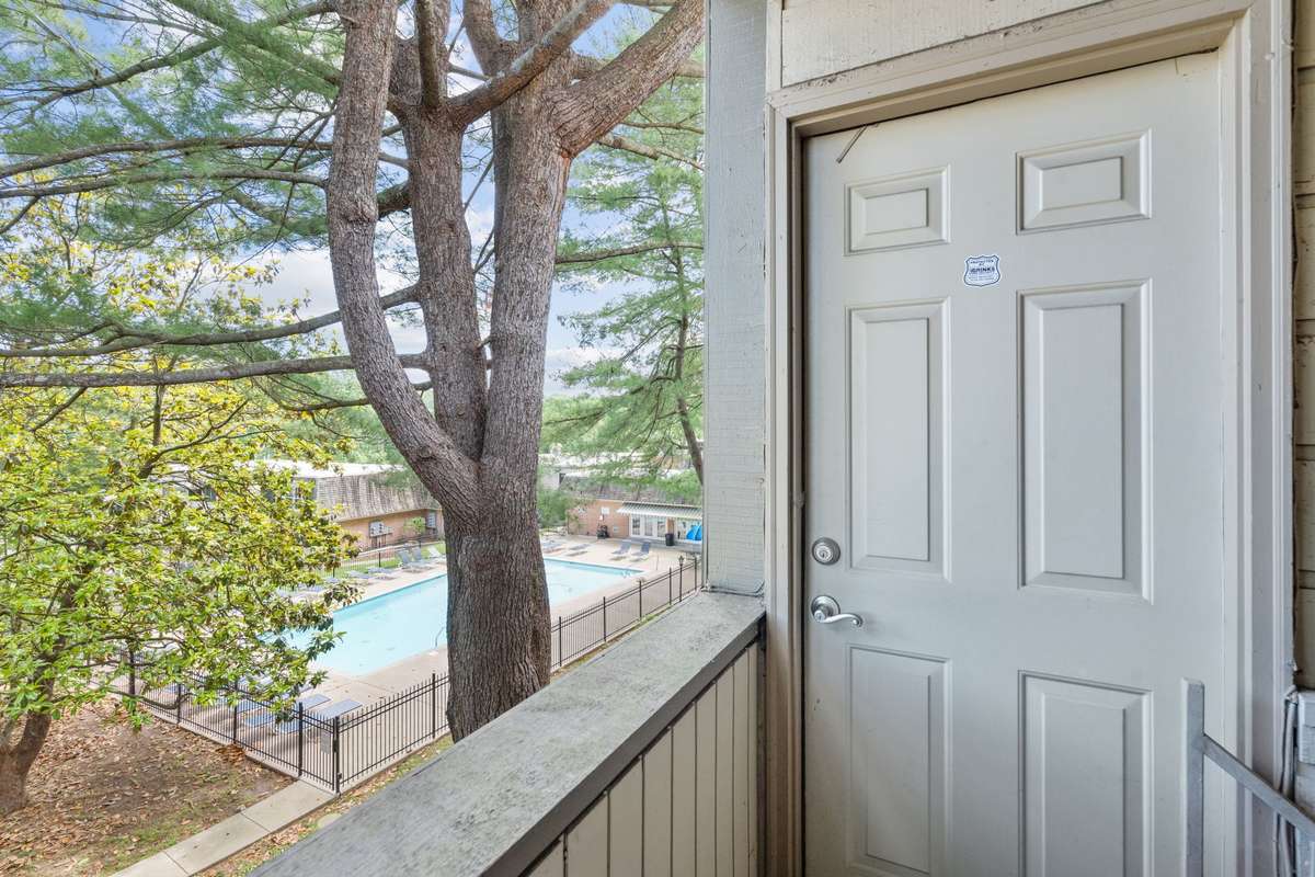 The back door access from the Florida Room to the beautiful Versaille community grounds and pool.
