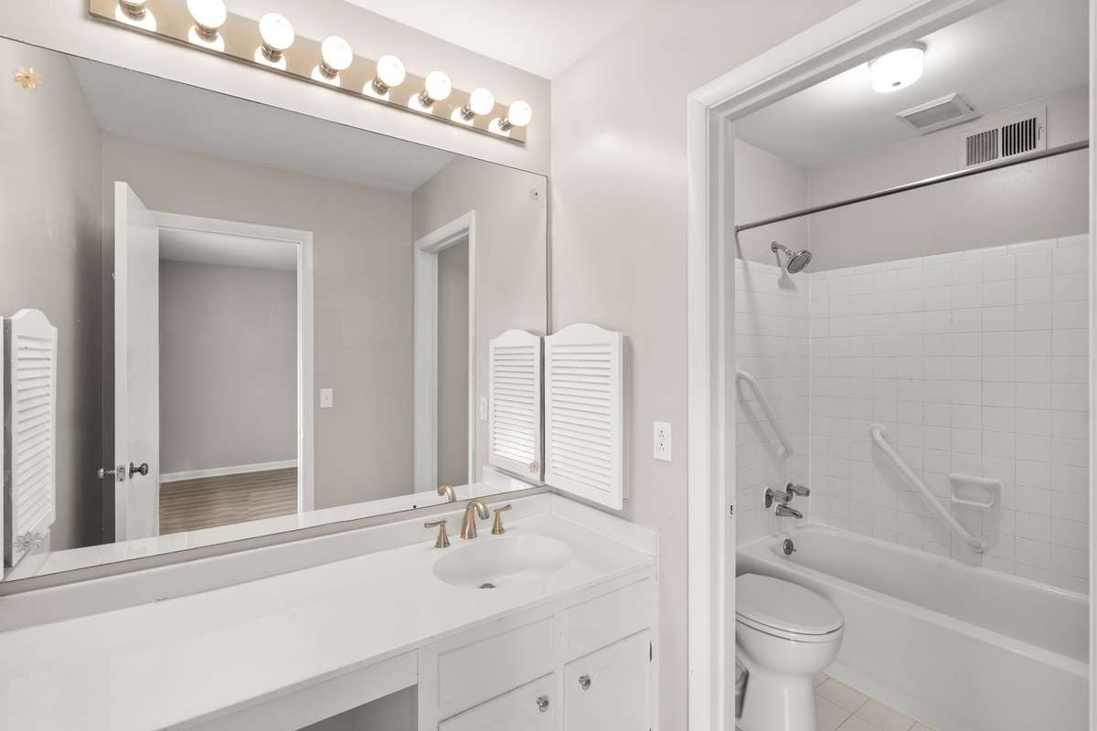The Primary Bathroom offers a large vanity counter and a shower/tub combo.