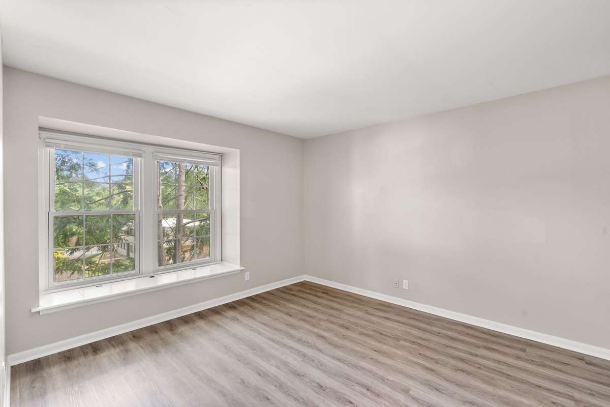 The second Bedroom also includes fresh paint, luxury vinyl plank flooring, lots of natural light, an extra large closet, and a charming window seat with storage. The second full Bathroom is located just beside the Bedroom.