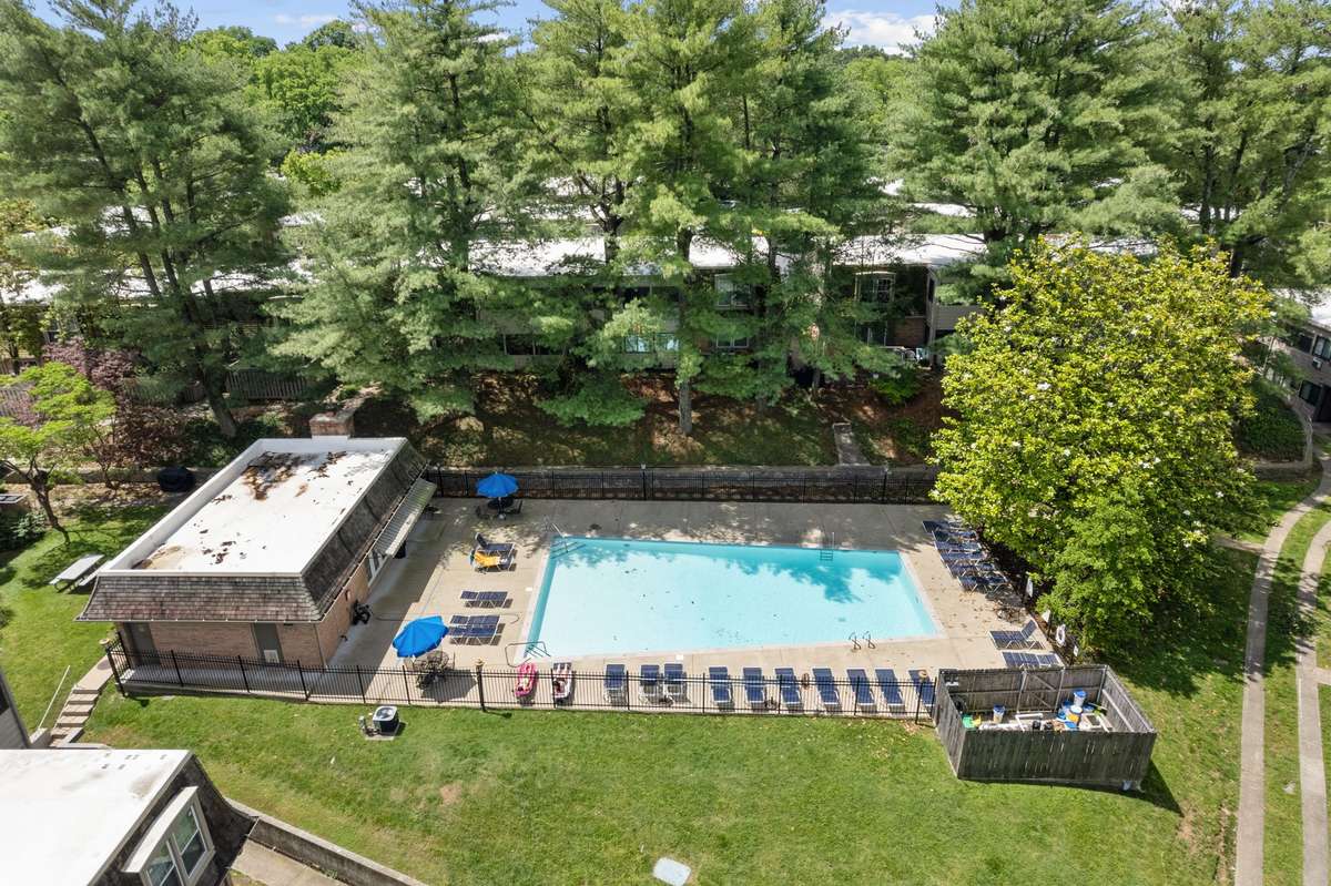 Versailles' peaceful and pristine community pool and clubhouse is conveniently located just behind Unit 45.