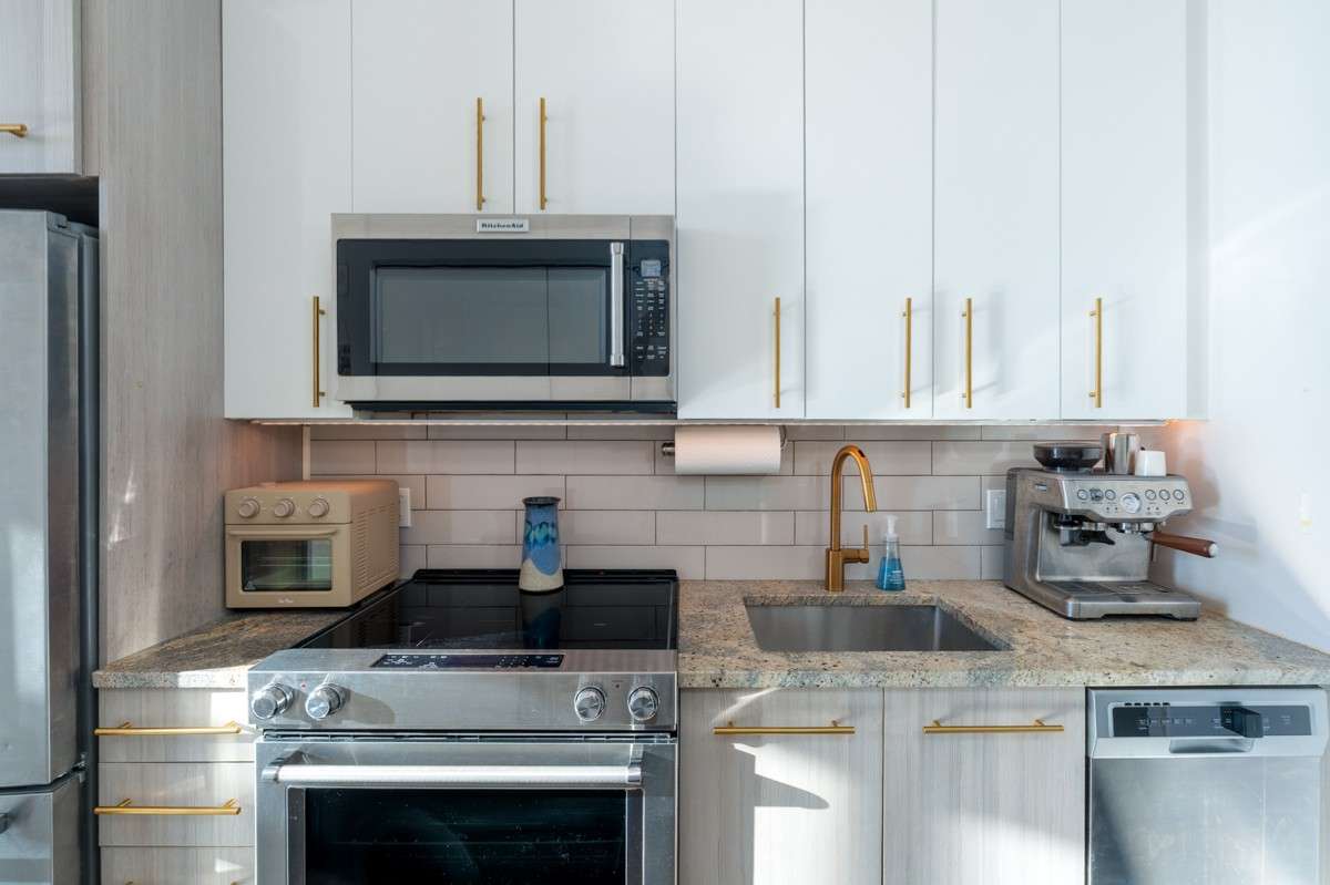 Modern cabinetry, clean lines, and smart storage solutions create a functional, yet elegant space!