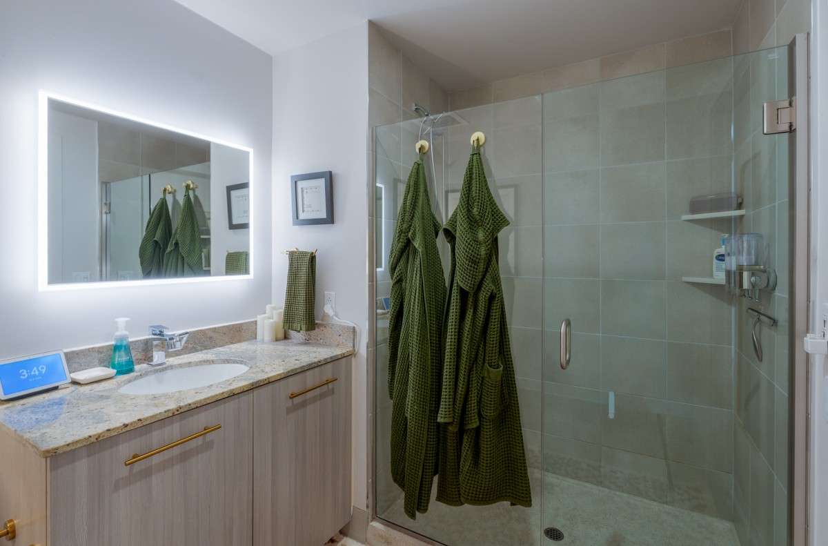 Spacious tile shower and vanity with modern beautiful finishes!