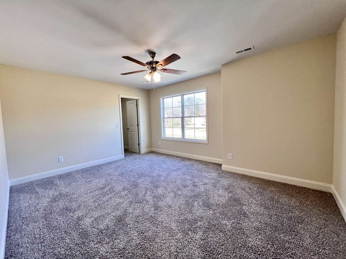 Bedroom #4 with walk-in Closet or It can easily be converted into a rec room or playroom, perfect for kids or bonus space.