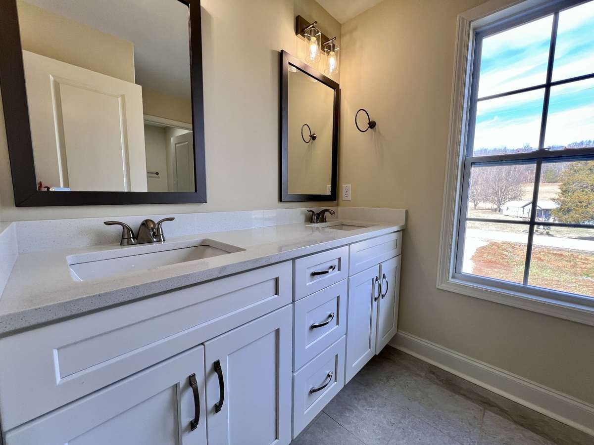 Double Vanity in the Primary Bathroom with separate area for shower/tub combo