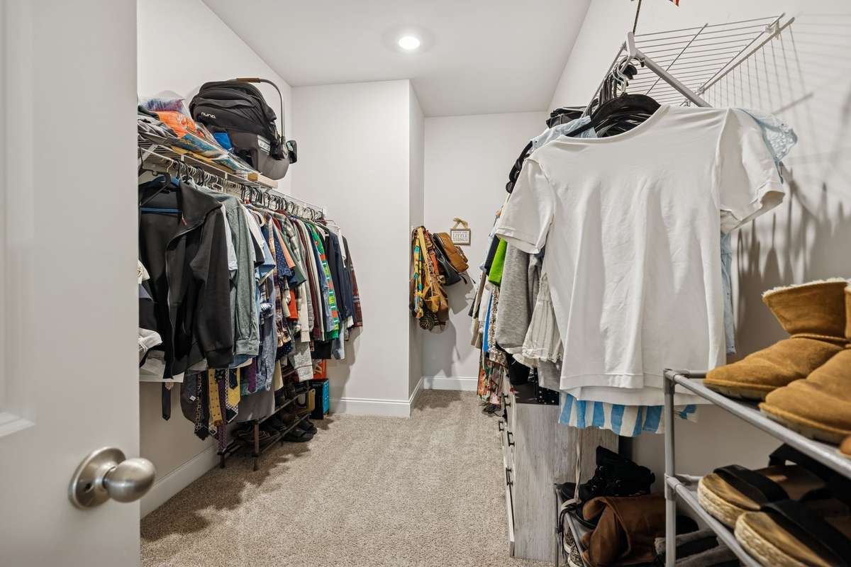 extra-large walk in closet off of the primary bedroom