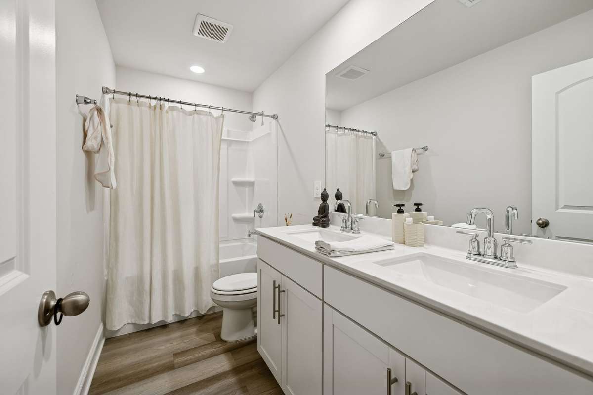Upstairs full bathroom with double vanities