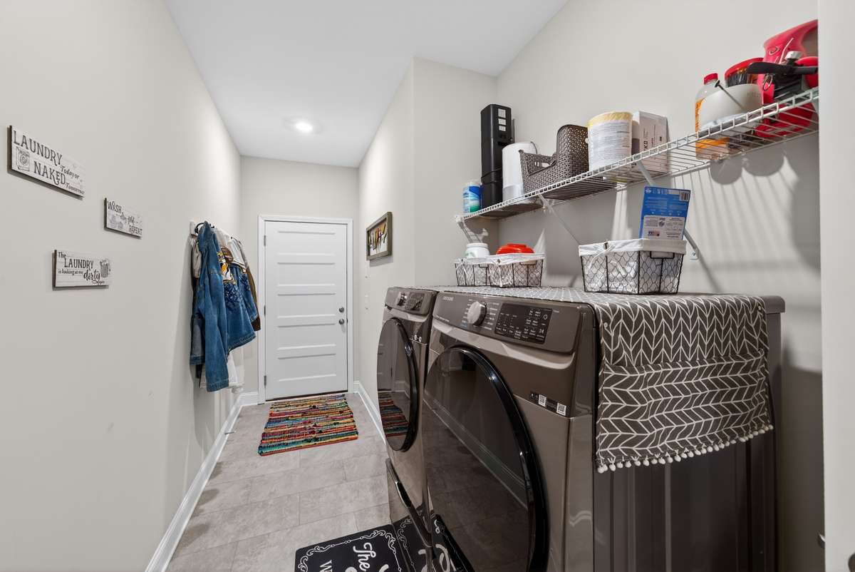 laundry room with w/d in garage hall