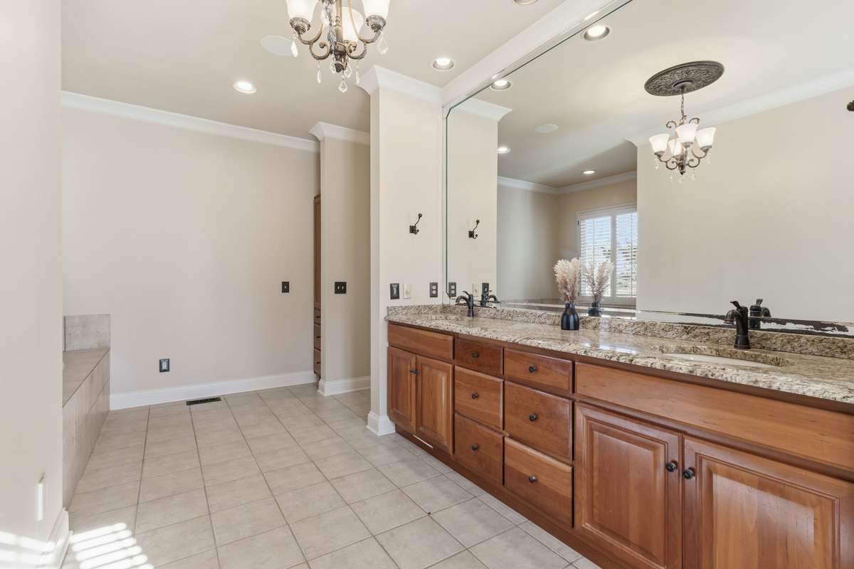 Primary Bath features double vanities, and a separate tub and shower