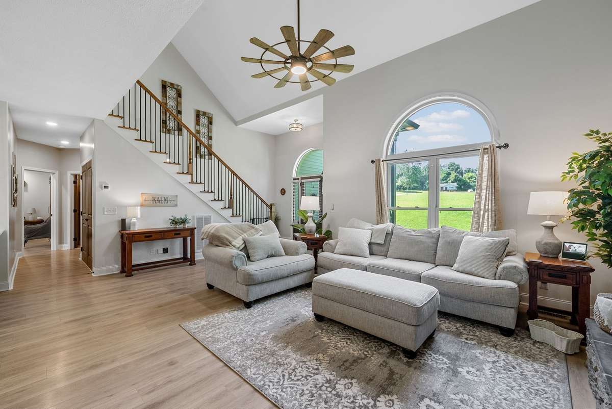 Soaring ceilings and sunlight filled living room!