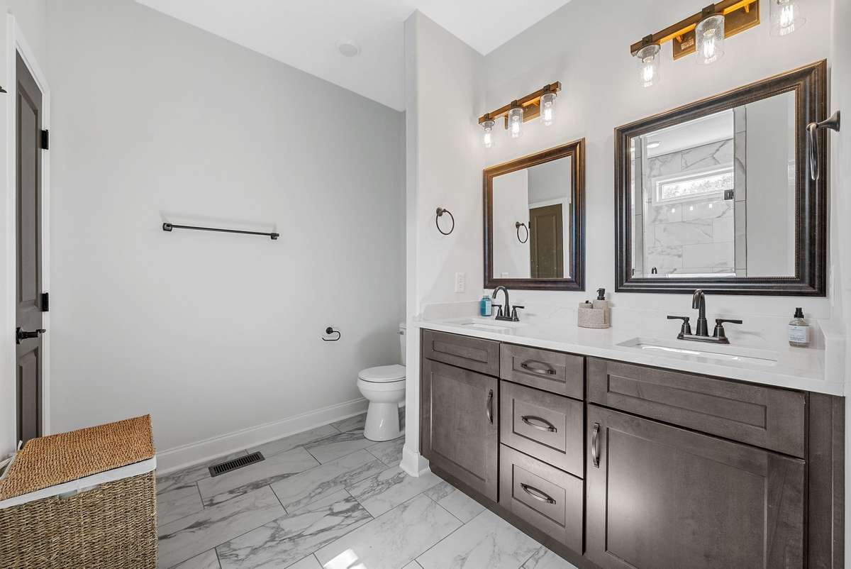 Double vanities and a stunning custom tiled shower!