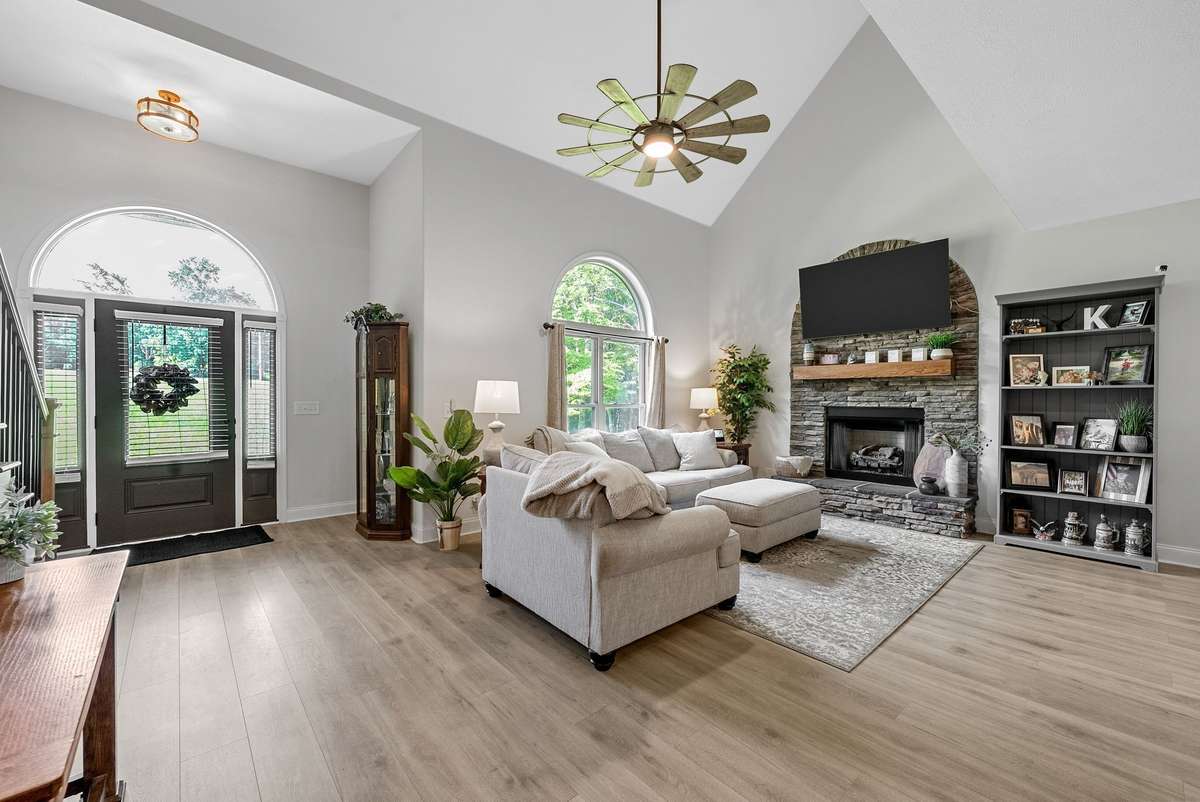 Soaring ceilings and sunlight filled living room!