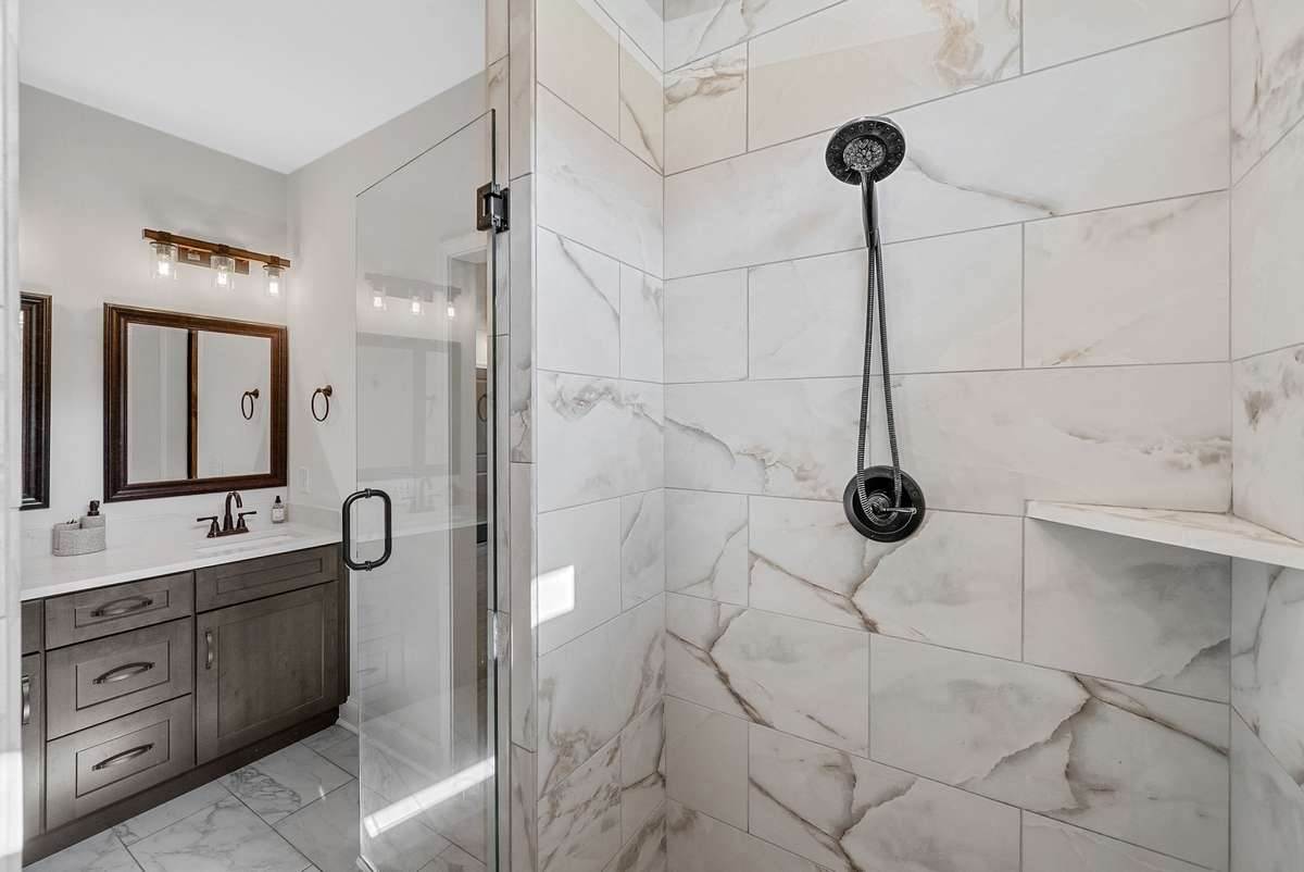 Double vanities and a stunning custom tiled shower!