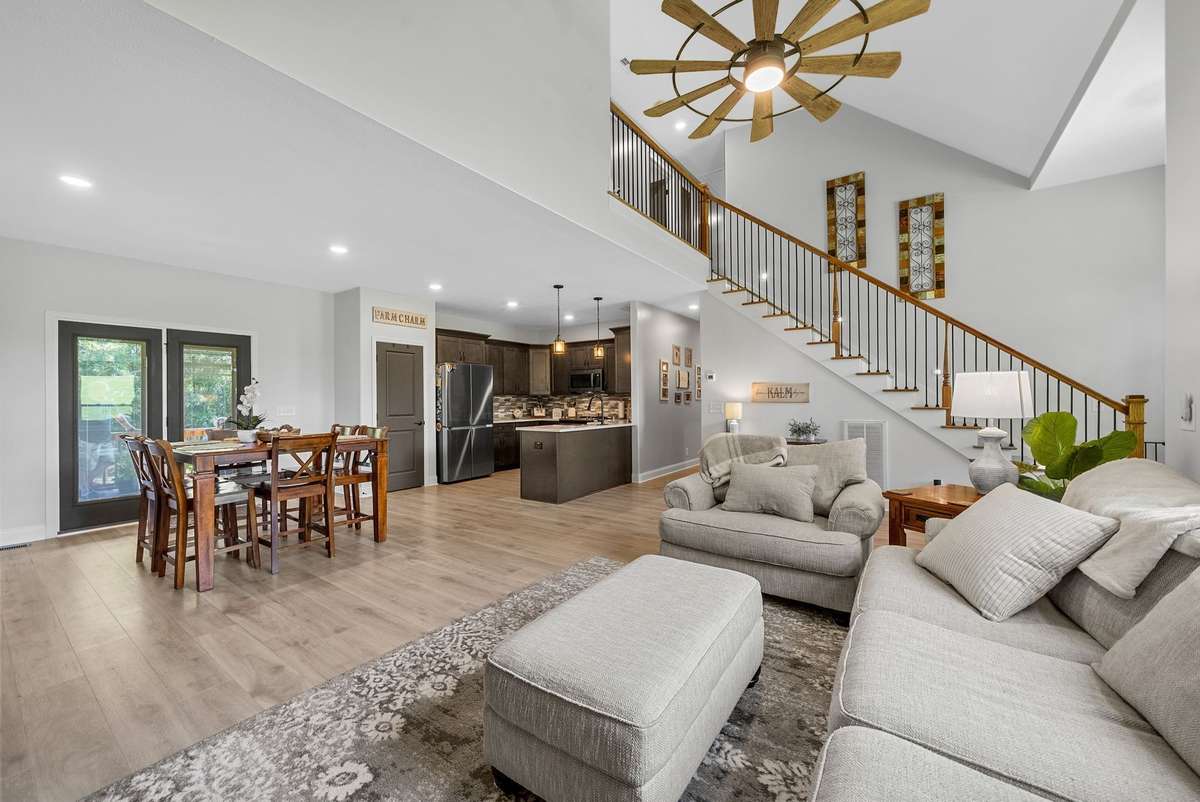 Beautiful design meets everyday function in this open kitchen/living room layout!