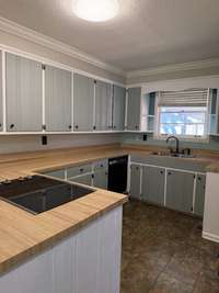 Lots of cabinets, cooktop stove and dishwasher too!