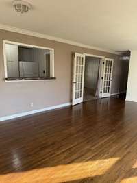 View of Large Living Room/Dining Room and Pass through Window to kitchen!