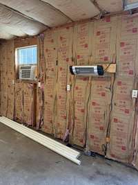 Insulated walls in garage with heat and ac unit