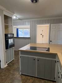 View of kitchen from the sink to breakfast bar
