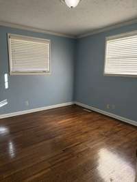 Another view of bedroom 2 with nice floors