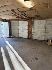 Double car garage with concrete floor