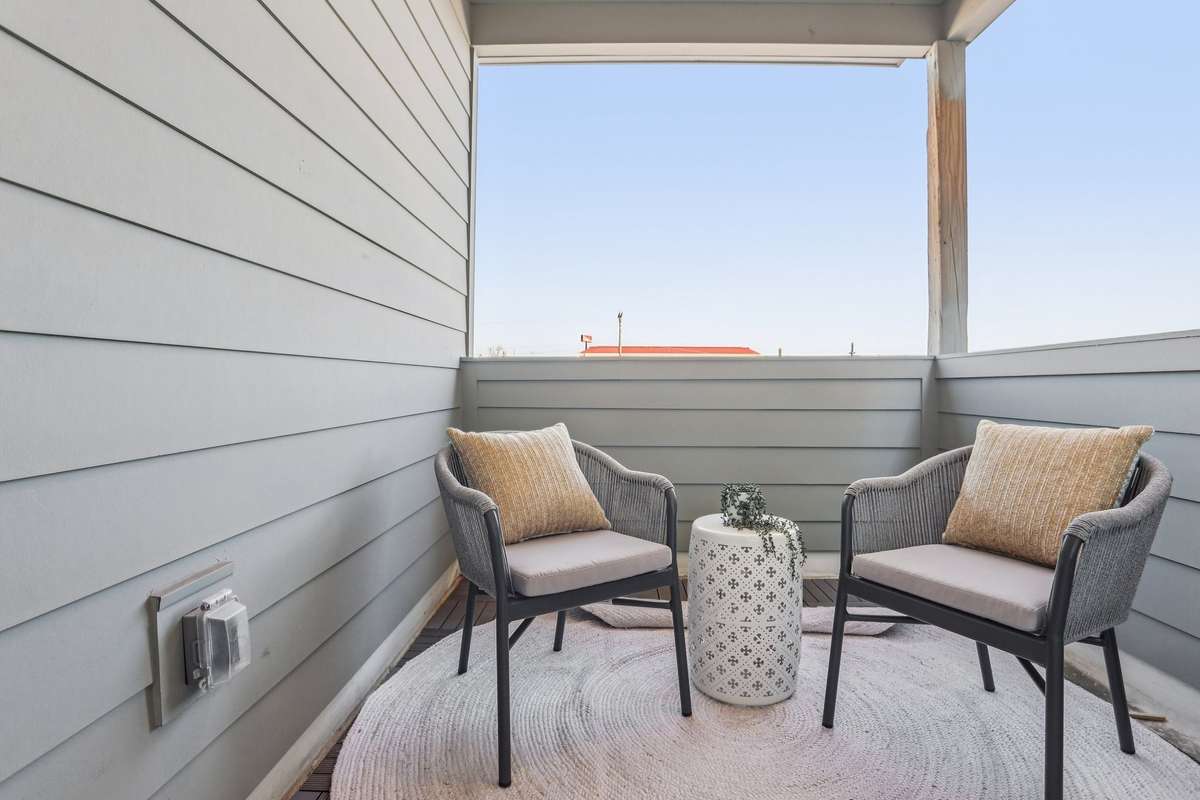 Private covered balcony provides a quiet spot for morning coffee or evening downtime.