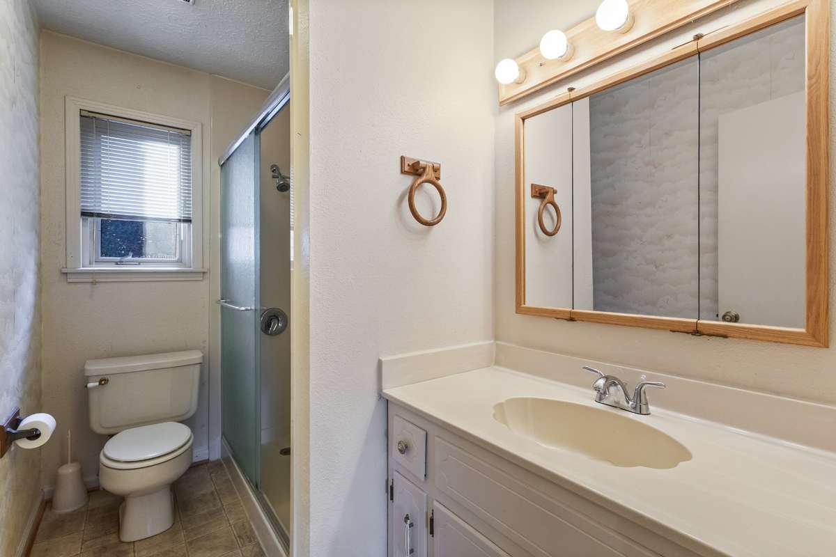Downstairs full bathroom off of the hallway.