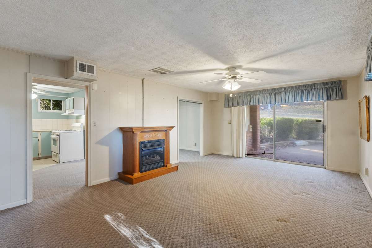 Lower living room. Sliding glass door to right side of house
