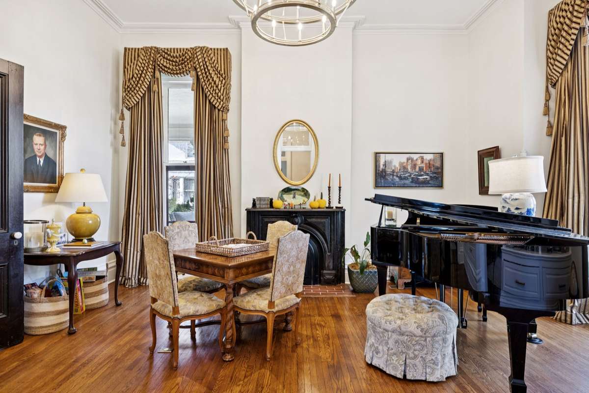 Seven marble fireplaces are immaculately preserved in the front parlors and bedrooms.