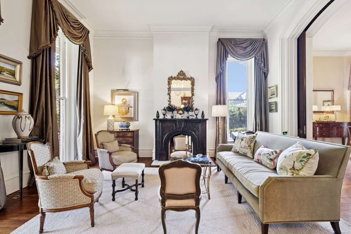 The double parlor as you enter on the left is divided by enormously grand pocket doors to separate the living room from the dining room and their fabulous 13’ ceilings.