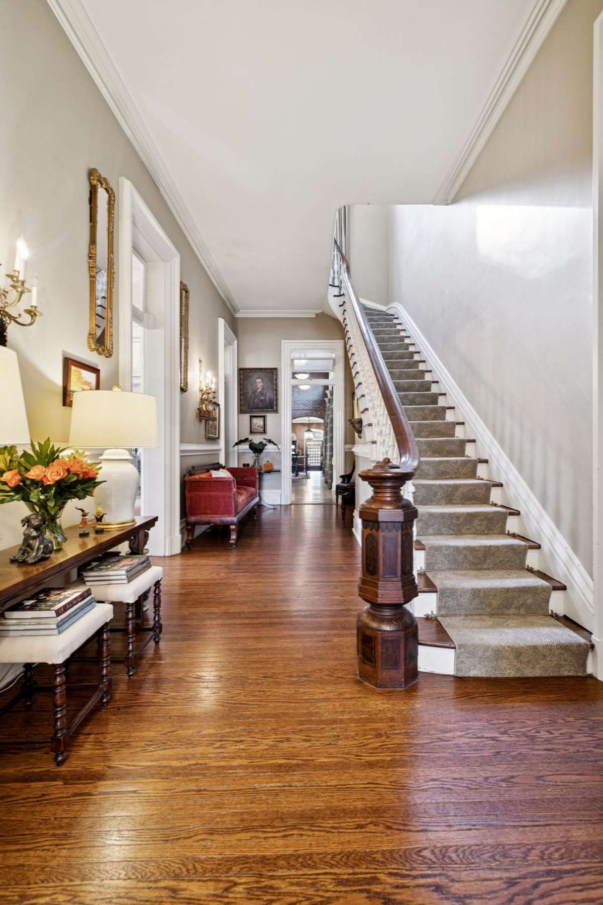One of the home’s original features is the gorgeous newel stairway.