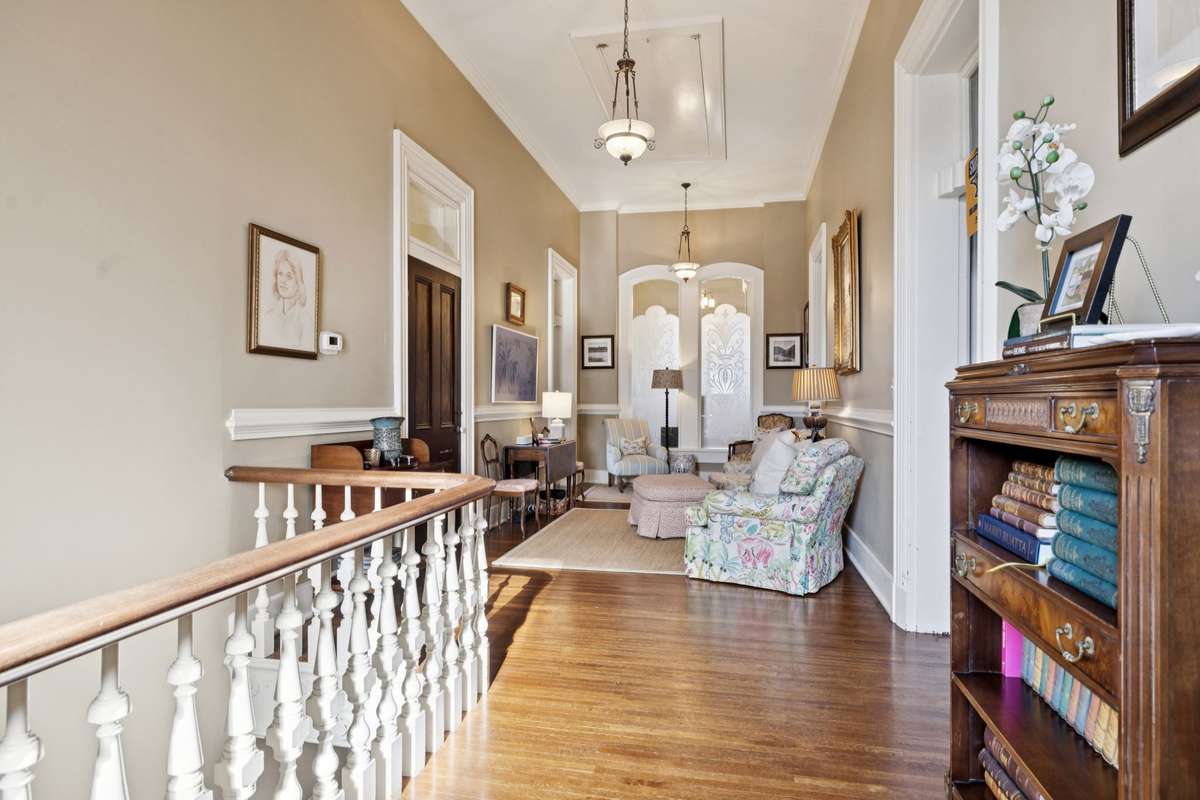 As you ascend the 25-step staircase, it softens into a gentle curve, with its graceful banister overlooking the foyer below.