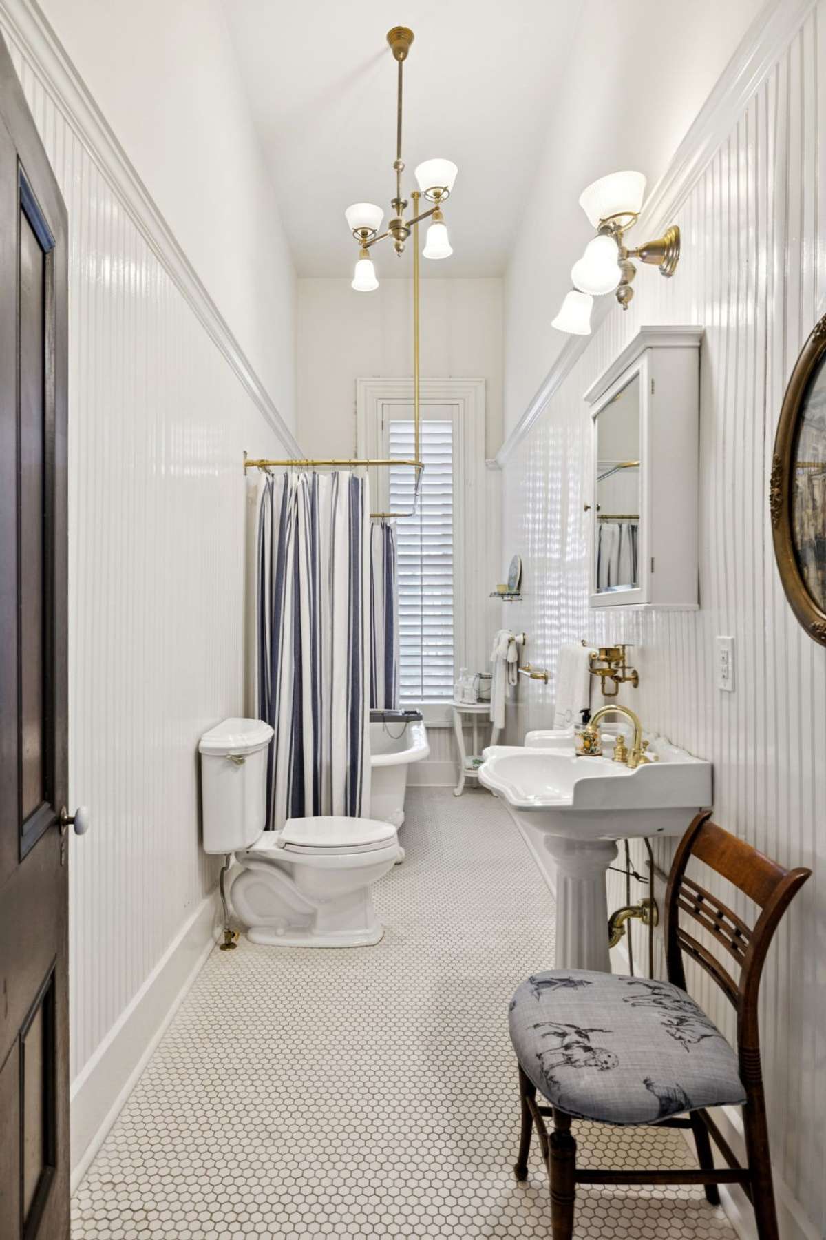 The upstairs bathroom still has the original clawfoot tub.