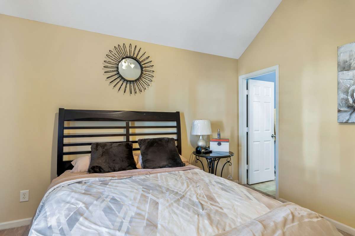 Primary Bedroom with attached Full Bathroom Suite and Walk-in Closet