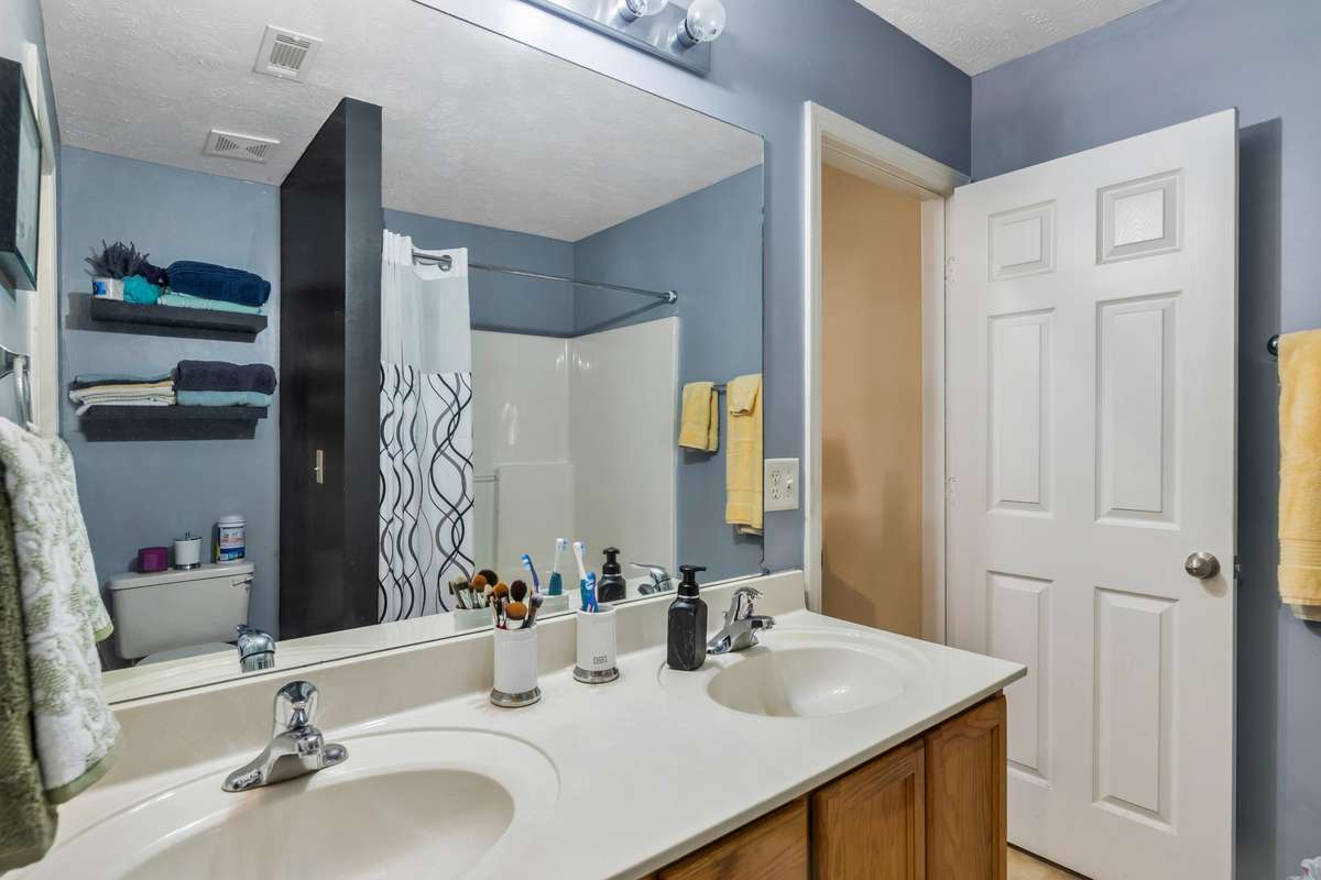 Full Bathroom # 1 - Primary bedroom bathroom with double vanities and walk-in closet