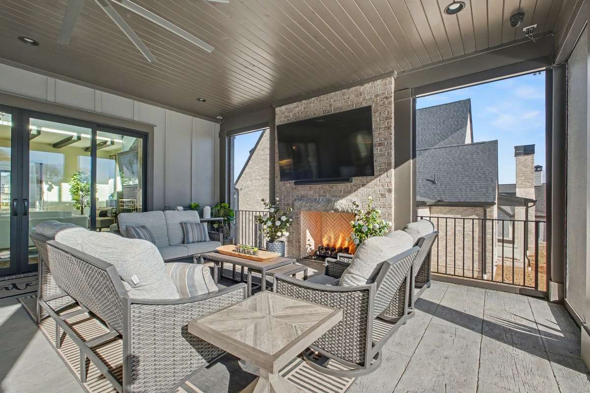 Another View of the Covered Porch and Outdoor Gas Fireplace and TV