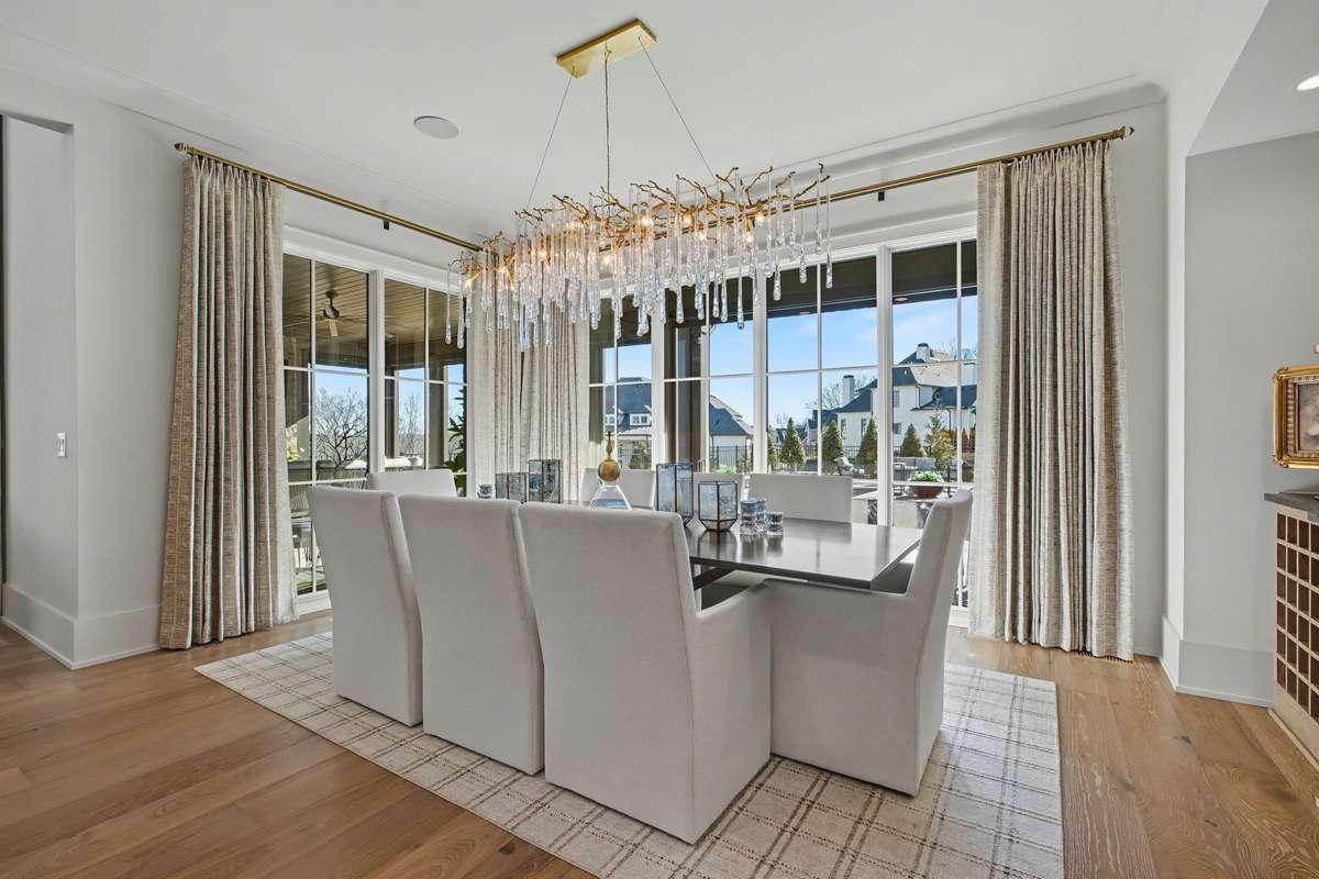 Dining Area Featuring Another Restoration Hardware Fixture providing a View of the Luxurious Pool/Hot Tub/Entertaining/Lounging Areas and Back Yard