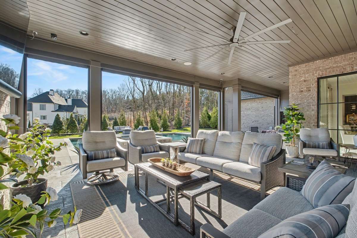 Welcome to this Spectacular Outdoor Entertaining/Lounging Covered Patio off the Great Room that Overlooks the Expansive Pool/Hot Tub/Outdoor Grill & Back Yard