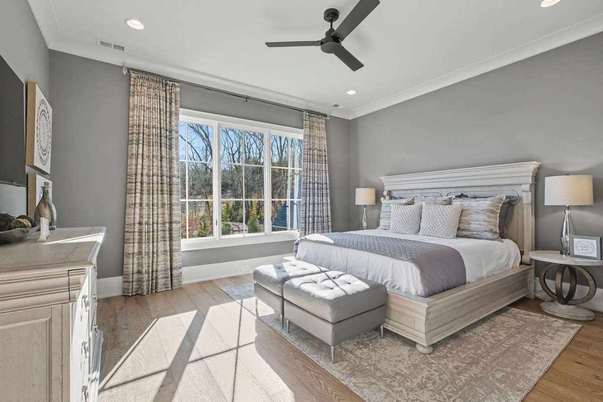 Bedroom 4 overlooks the Back Yard/Pool Area/Wooded Neighborhood Common Area